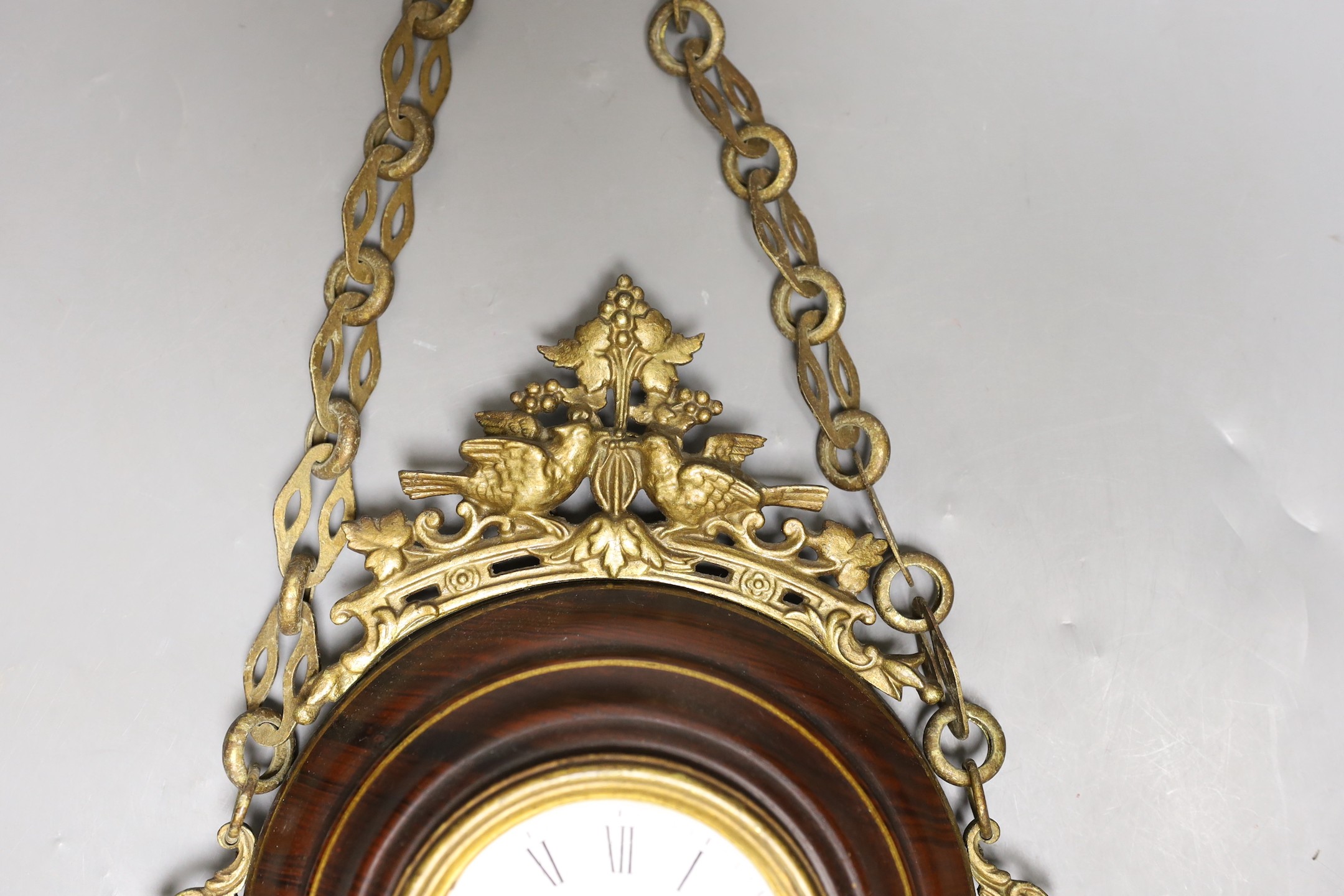 A French faux wood and gilt metal hanging wall clock, 35cm